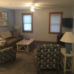 A living room with two couches and a television.