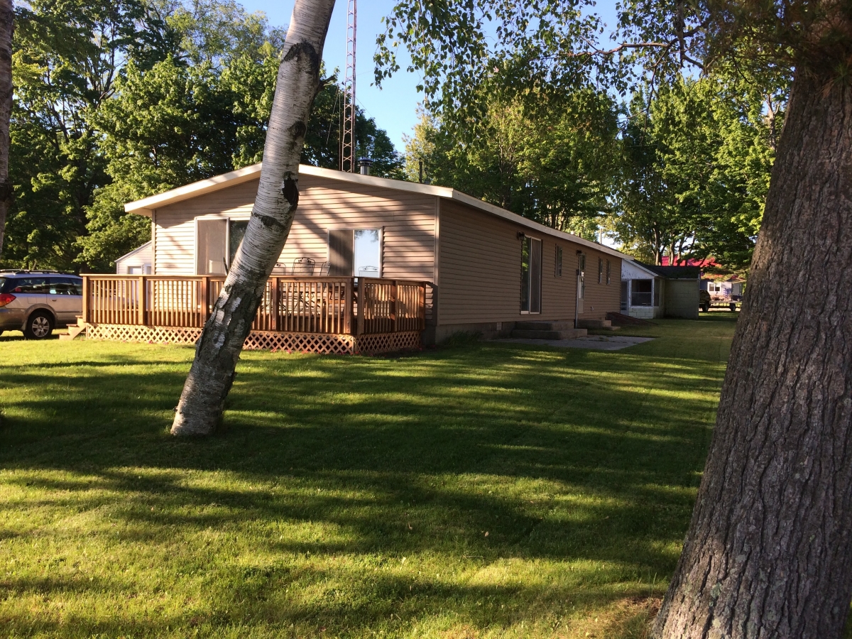 A house with a tree in the background