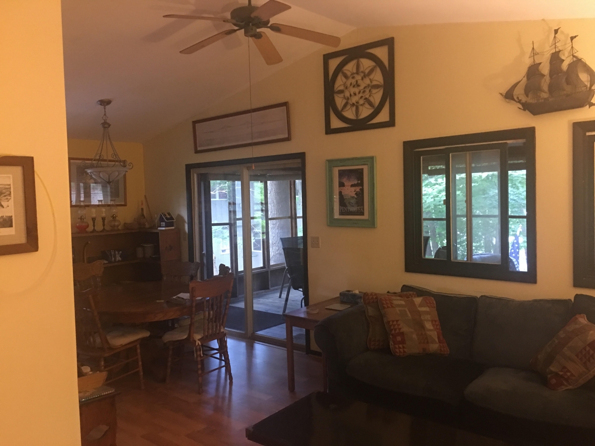 A living room with a couch and table in it