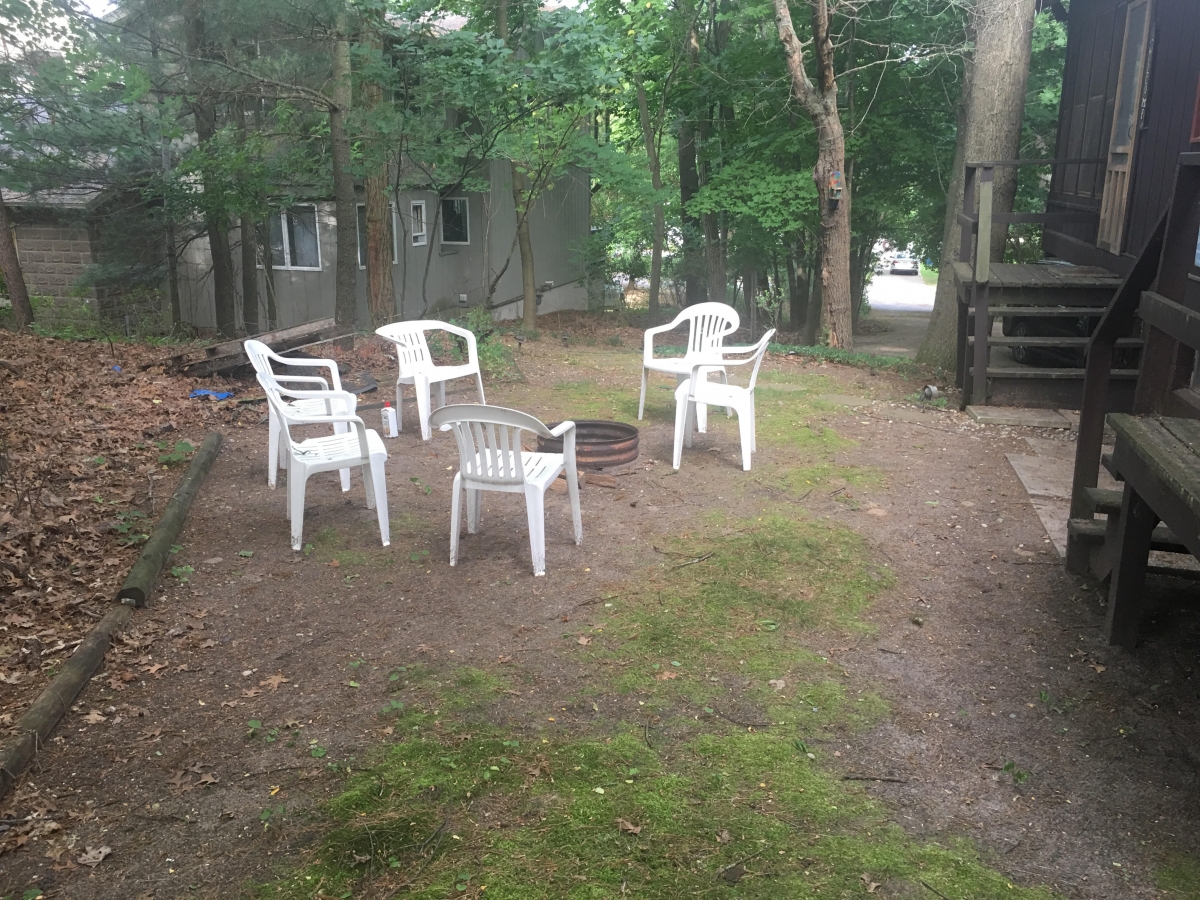 A group of chairs sitting in the middle of a field.