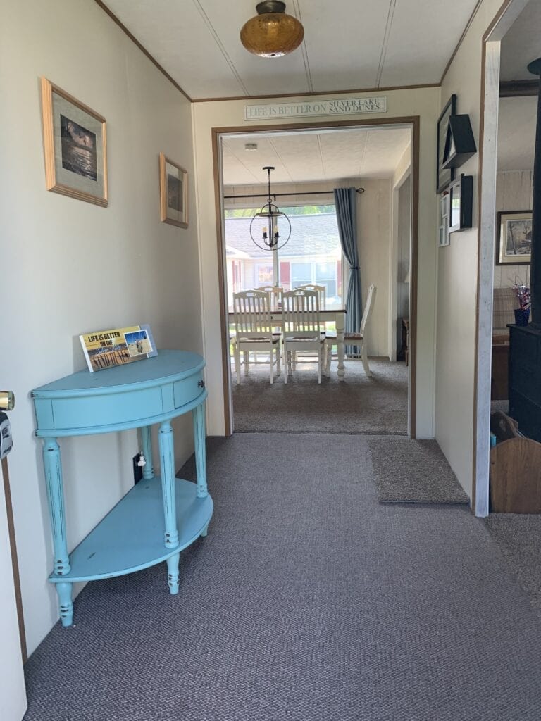 A blue table in the middle of a room.