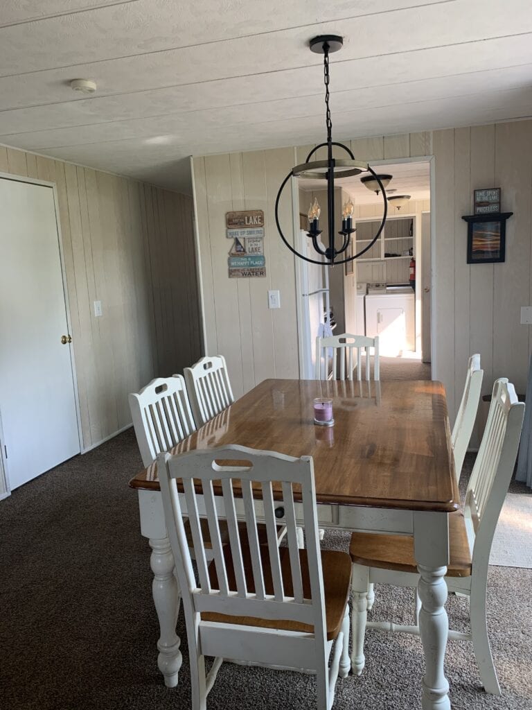 A dining room table with chairs around it