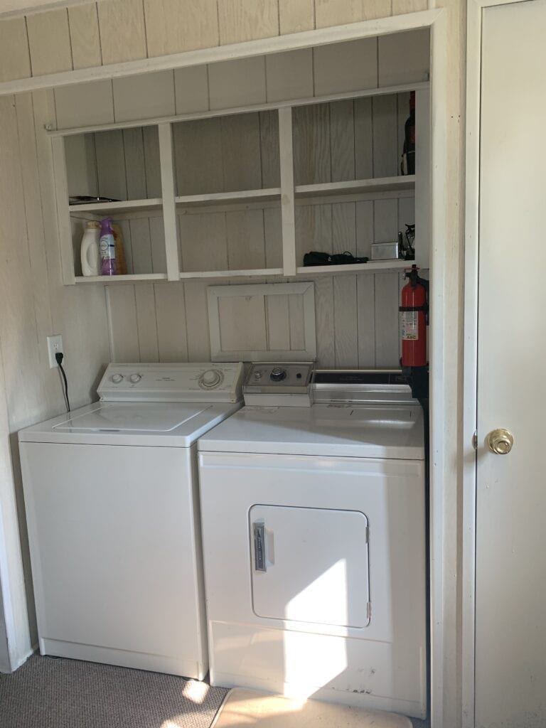 A white washer and dryer in a room.