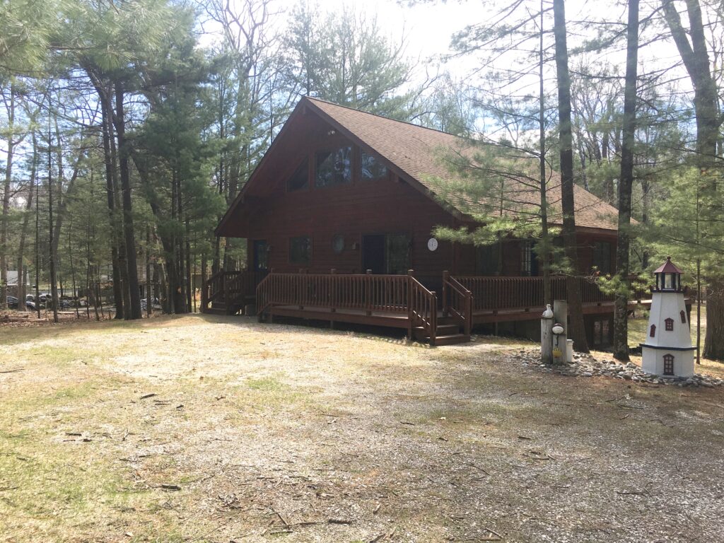 A cabin in the woods with a fire hydrant