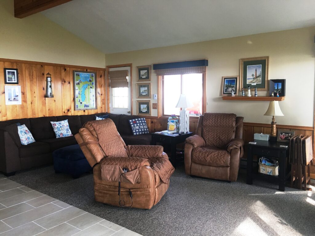 A living room with couches and chairs in it