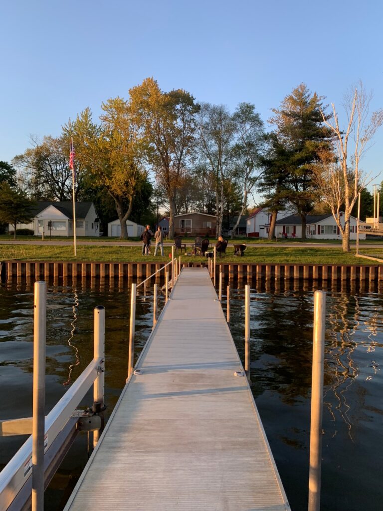 A dock with a wooden pier in the middle of it.