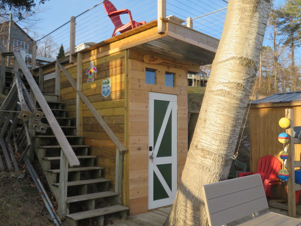 A wooden structure with stairs and a red chair.