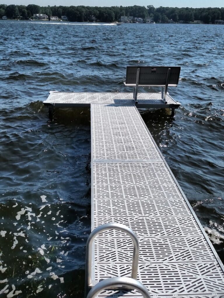 A dock with a bench in the middle of it