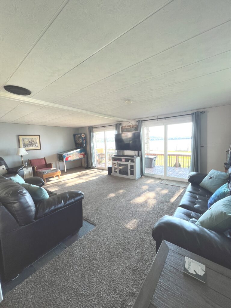 A living room with two couches and a television.