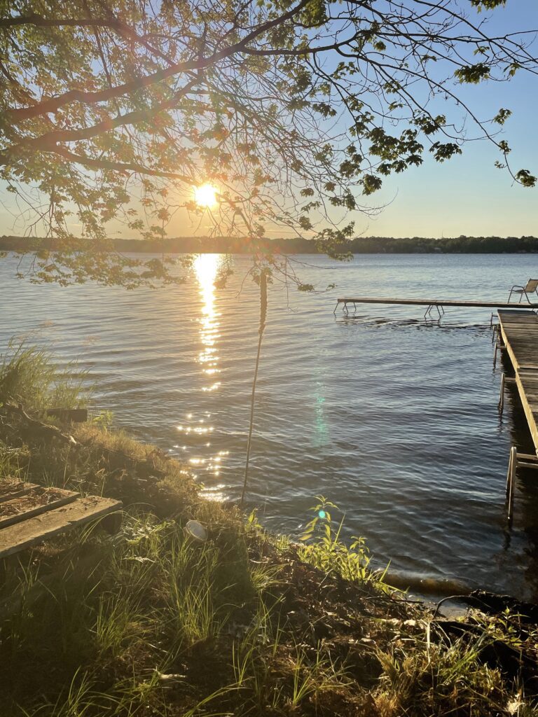 A dock with a pier in the middle of water