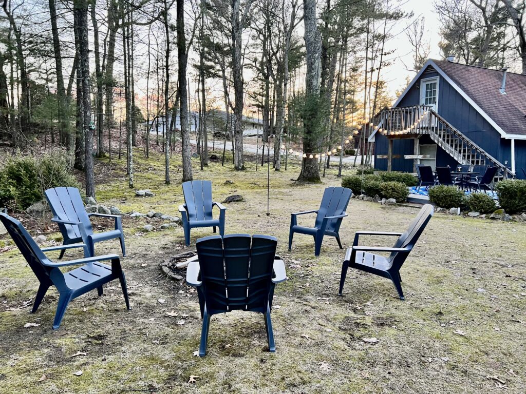 A group of chairs sitting in the middle of a field.