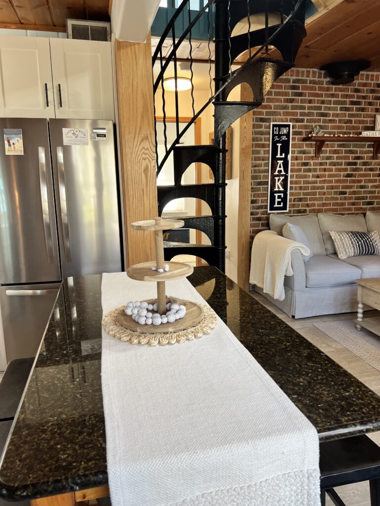 A kitchen with a table and chairs in it