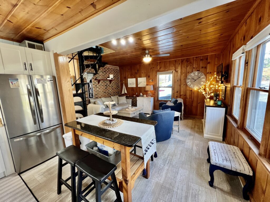 A kitchen with a table and chairs in it