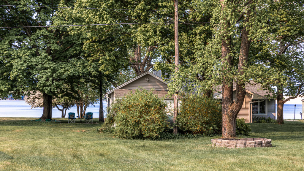 A house sitting in the middle of some trees